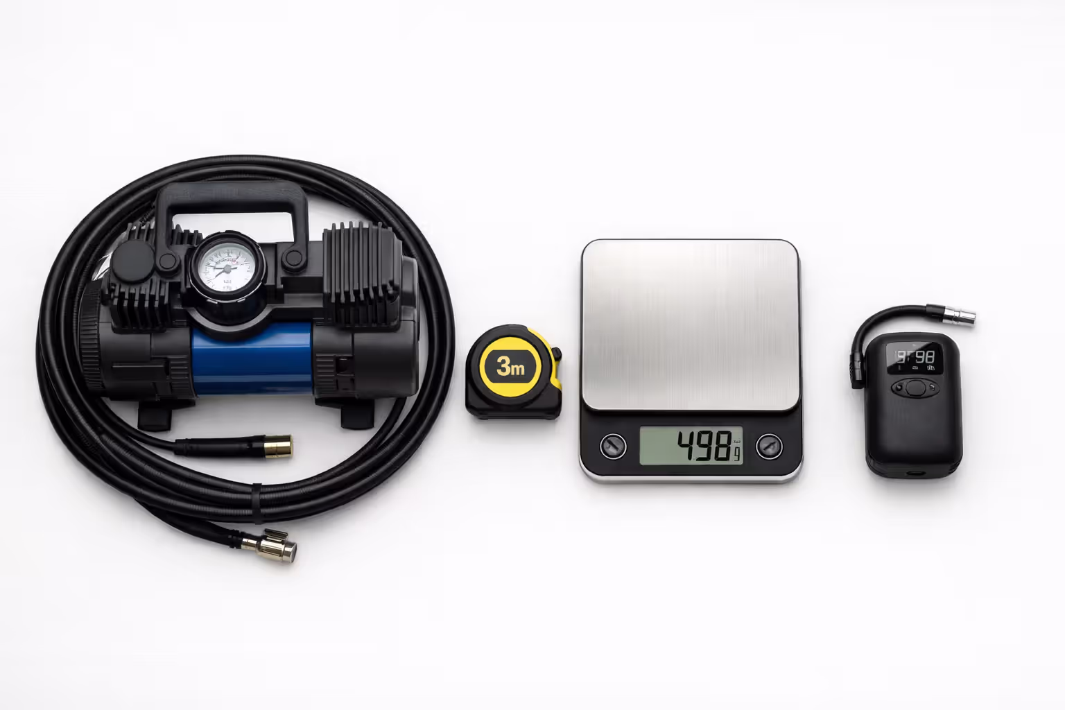 Size and weight comparison of a large heavy tire compressor versus a compact lightweight portable inflator