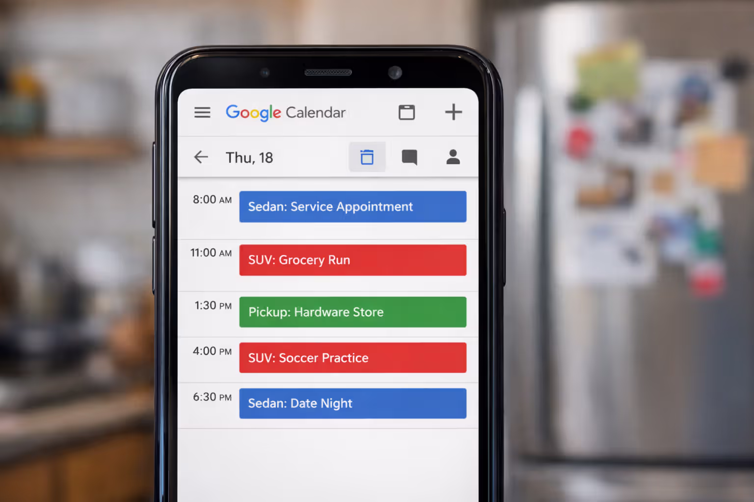 Smartphone screen showing color-coded Google Calendar with vehicle usage schedule for family cars